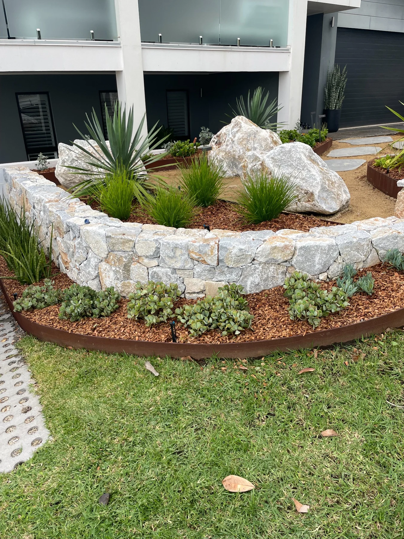 Stone, steel & sculpted planting